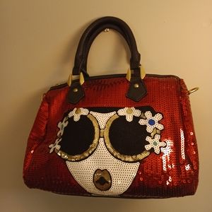 Red sequin purse with lady in flower sunglasses